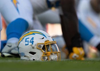 A Los Angeles Chargers helmet with the number 54 on the sideline, representing the Top 10 Los Angeles Chargers of All Time and their legendary players.