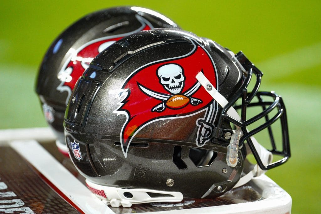 Close-up of Tampa Bay Buccaneers helmets on the sideline, representing the Top 10 Tampa Bay Buccaneers of All Time and their iconic history.