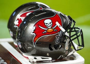 Close-up of Tampa Bay Buccaneers helmets on the sideline, representing the Top 10 Tampa Bay Buccaneers of All Time and their iconic history.