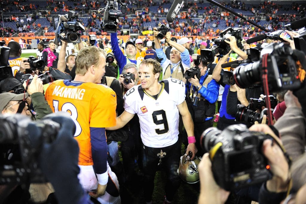 Peyton Manning and Drew Brees after a game, representing the top 10 white quarterbacks of all time in NFL history.