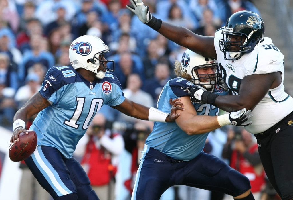 Vince Young of the Tennessee Titans avoiding a pass rush during a game against the Jacksonville Jaguars.