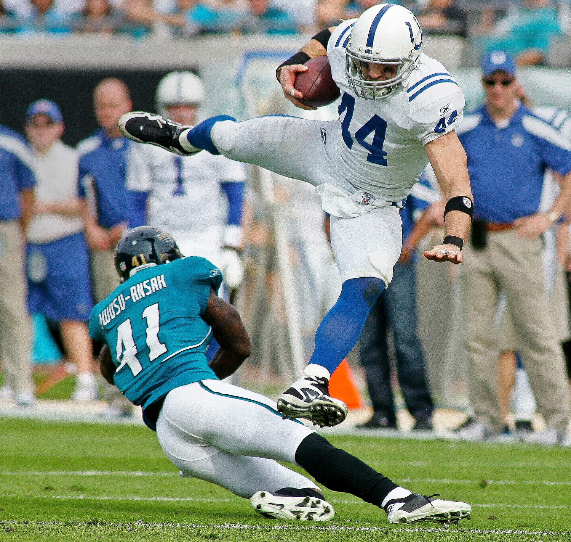 Dallas Clark, considered one of the best tight ends of all time, leaps over a defender during a game for the Indianapolis Colts.