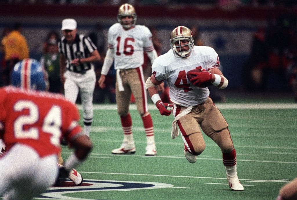 Tom Rathman, one of the best white NFL players of all time, running the ball for the San Francisco 49ers.