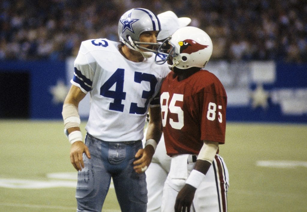 Cliff Harris, a famous white NFL player with some on field banter with Mel Grey. 