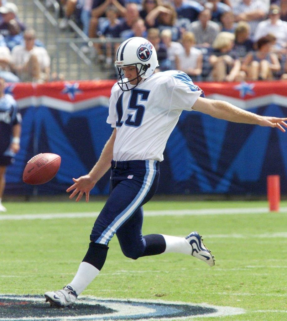 Craig Hentrich, recognized as one of the best white punters, executing a punt for the Tennessee Titans.