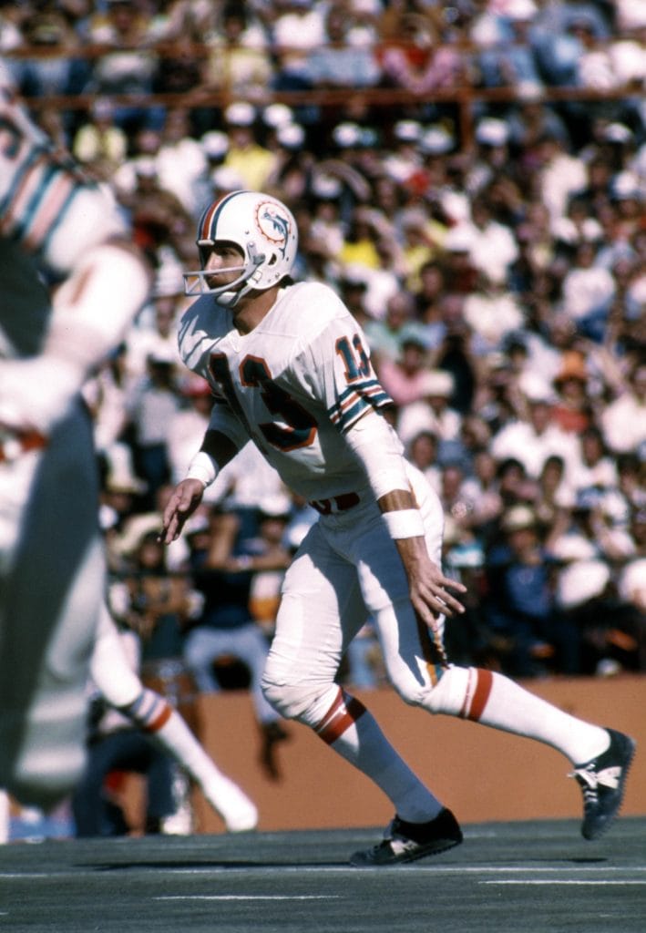 Jake Scott of the Miami Dolphins readies for a play, celebrated as a famous white free safety and one of the best white NFL players.