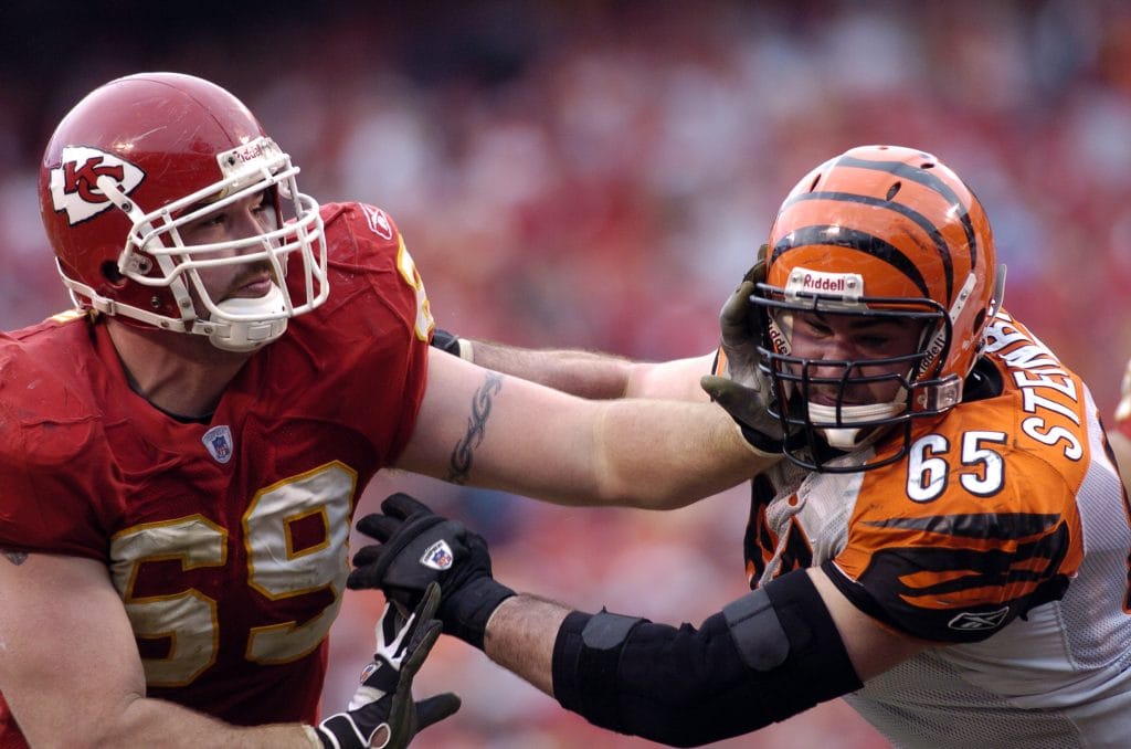 Jared Allen in action on the field, showcasing his dominance as one of the Top 10 White Defensive Linemen of All Time.
