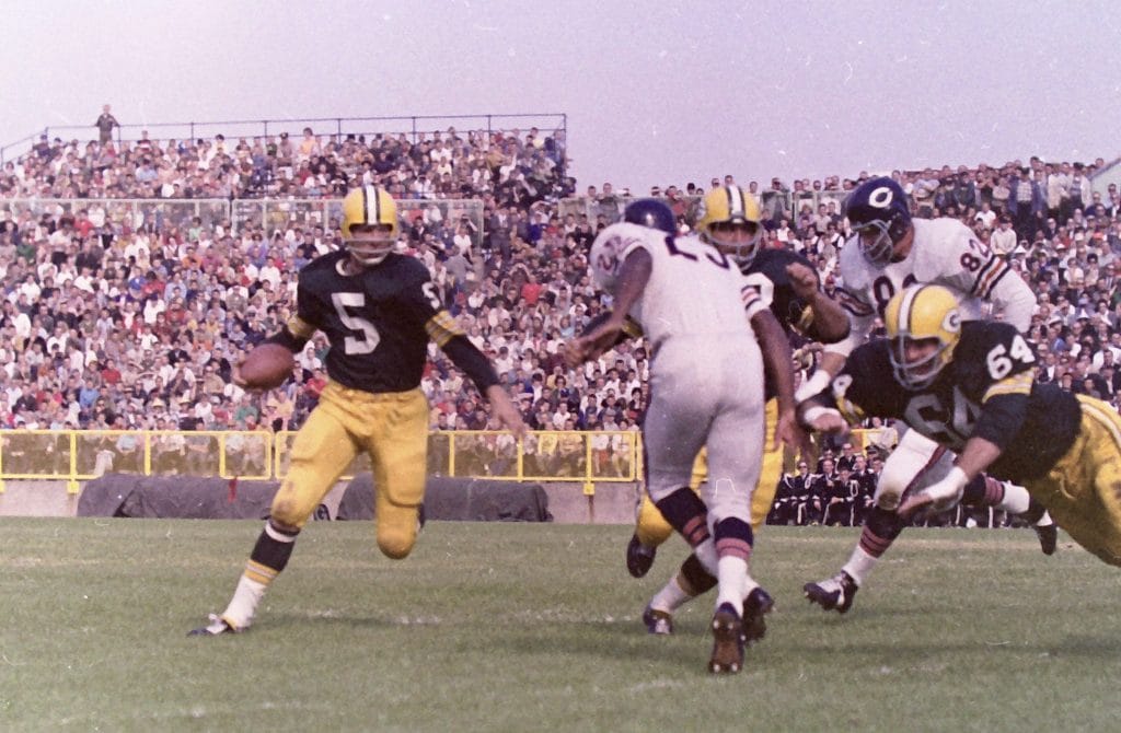 Paul Hornung, a top 10 white running back of all time, making a run for the Green Bay Packers with a block from Jerry Kramer. 