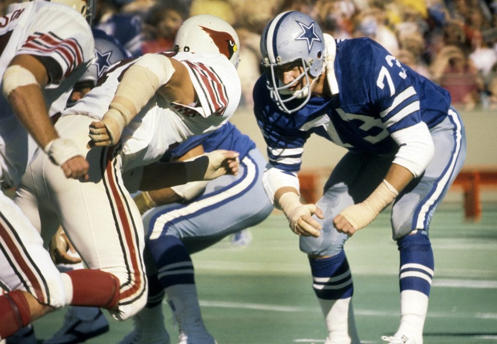 Ralph Neely of the Dallas Cowboys, one of the best white offensive tackles in NFL history, preparing for a snap during a game.