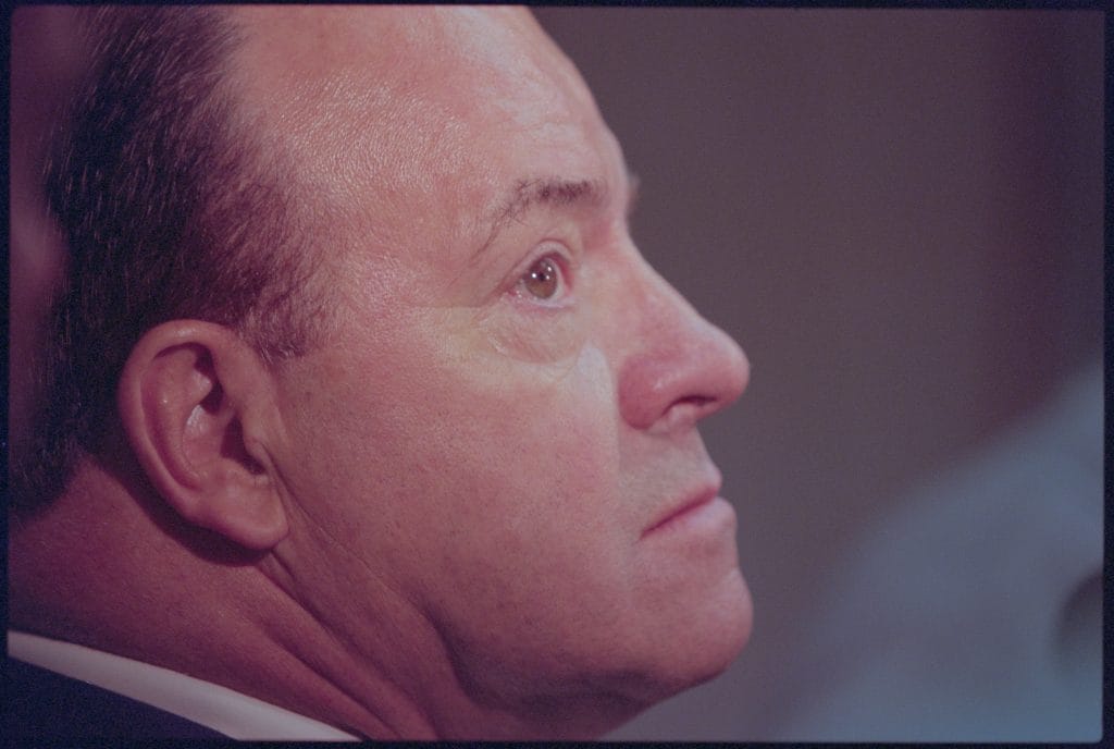 Scotty Bowman, legendary NHL coach, featured in Sortie Sports' Top 10 White Coaches of All Time for his unparalleled success in hockey.