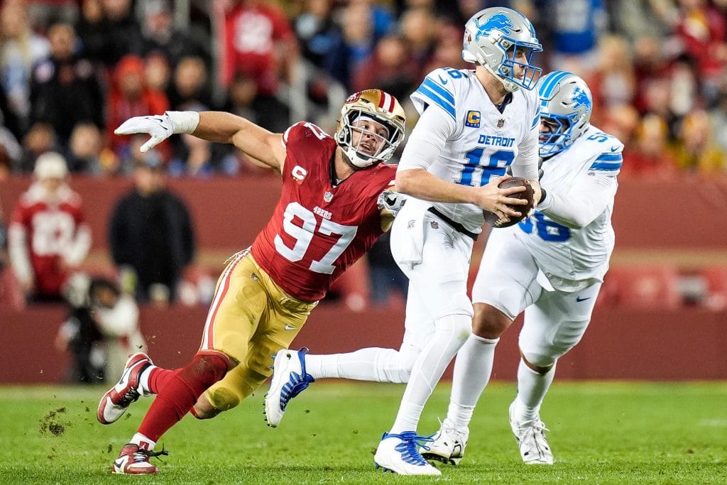 Nick Bosa, one of the top 10 white defensive ends of all time, chases down the quarterback during an NFL game.