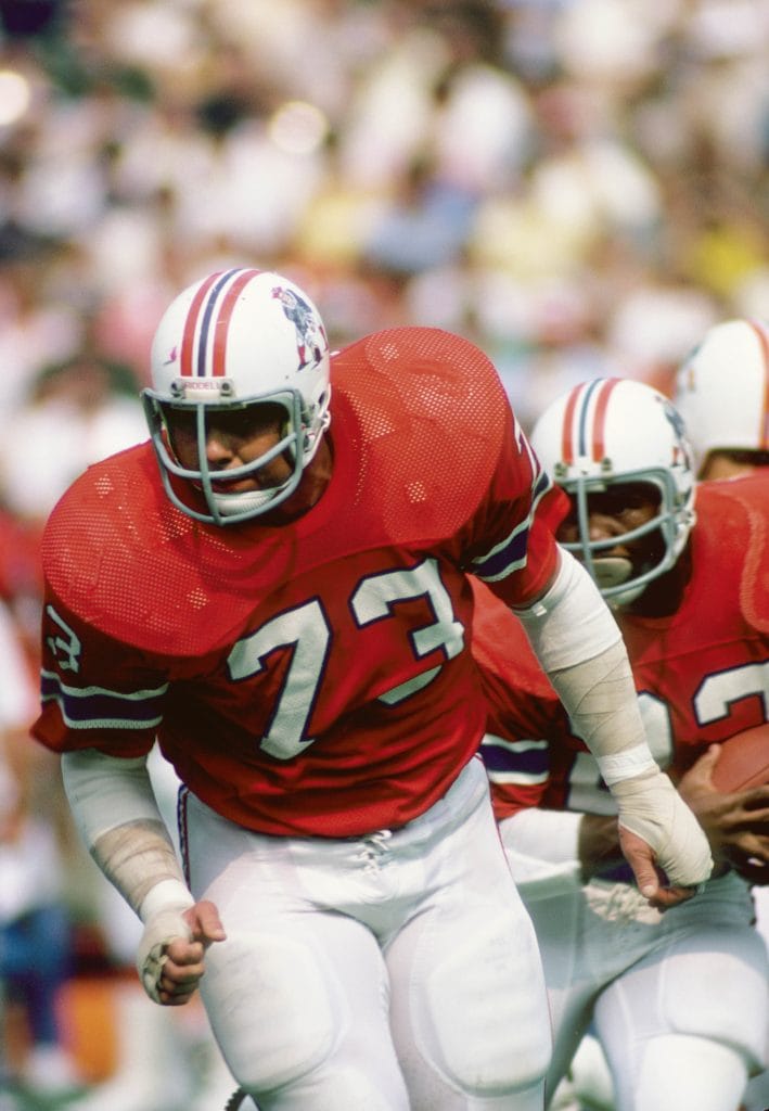 John Hannah in action, a key figure on the Top 10 White NFL Offensive Guards of All Time list, showcasing his dominance with the New England Patriots.