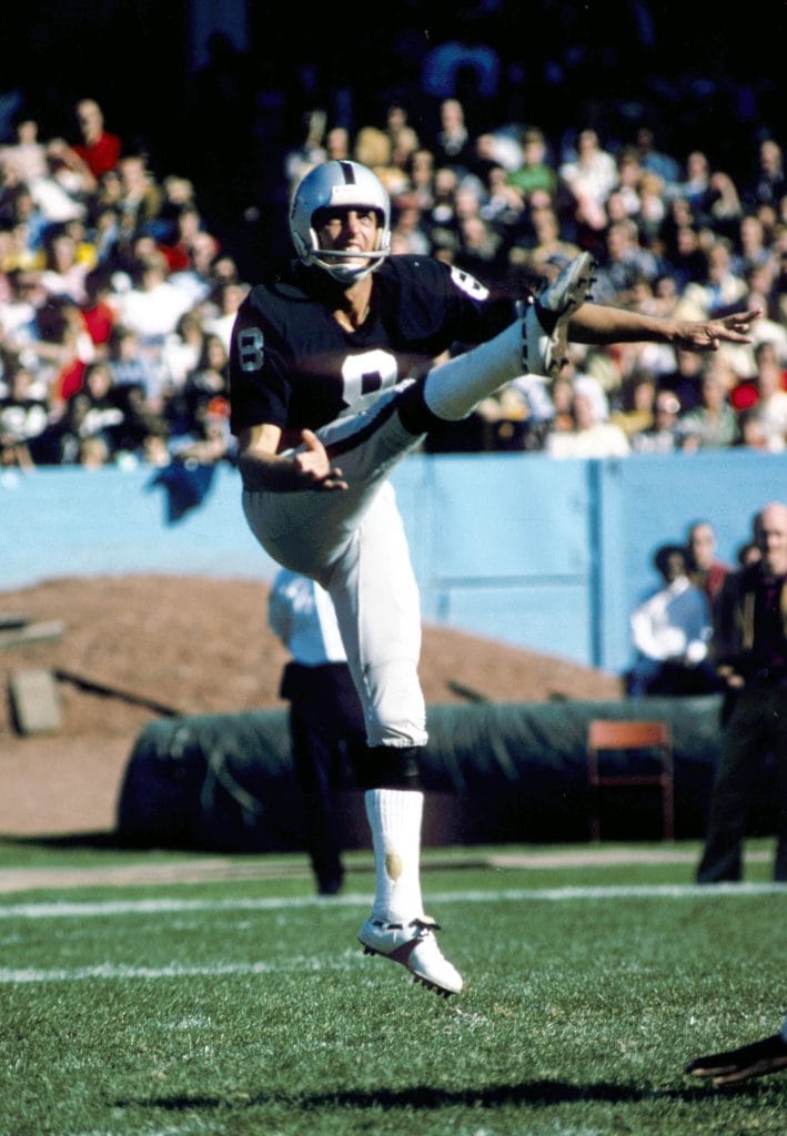 Ray Guy punting for the Raiders, representing one of the Top 10 White Punters of All Time.