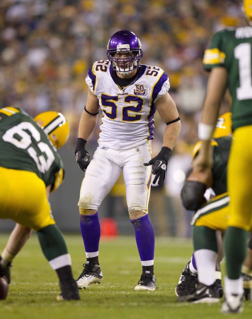Chad Greenway, Minnesota Vikings linebacker, preparing for a defensive play during an NFL game, representing Top 10 White Weakside Linebackers of All Time.