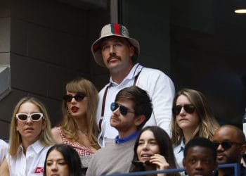 Travis Kelce, one of the most famous white football players, attending a game with Taylor Swift, further elevating his off-field fame.