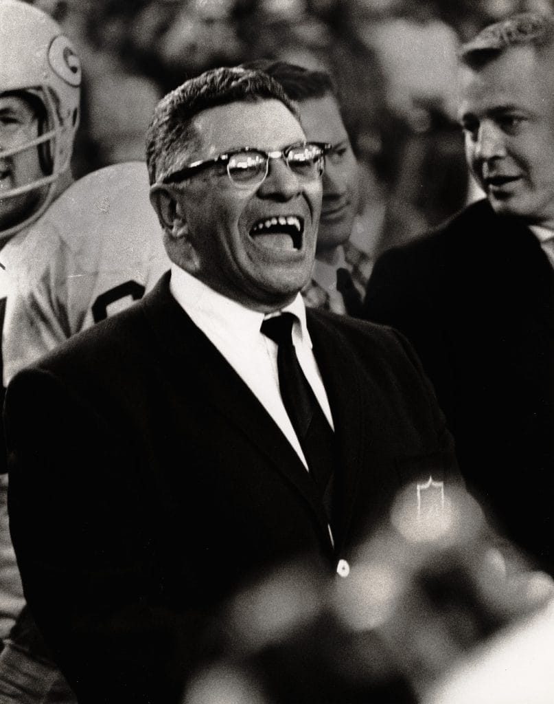 Vince Lombardi, regarded as the best white football coach, passionately leading the Green Bay Packers to greatness.
