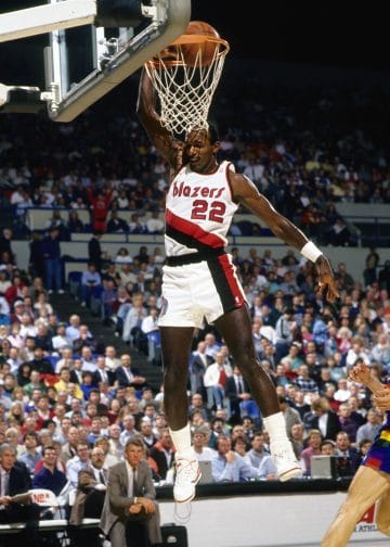 Clyde Drexler of the Portland Trail Blazers rising for a powerful dunk during an NBA game