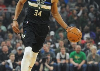 Giannis Antetokounmpo running the floor on a fast break, a dominant force in the Top 10 Power Forwards of All Time