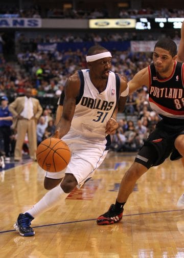 Jason Terry of the Dallas Mavericks dribbles past his defender — a sharpshooter known for clutch moments off the bench.