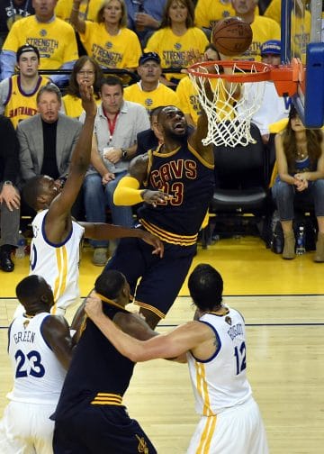 LeBron James going up for a layup in the NBA Finals, one of the Top 10 NBA Players of All Time