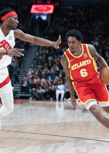 Lou Williams of the Atlanta Hawks dribbles past defender, one of the Top 10 Sixth Men of All Time.