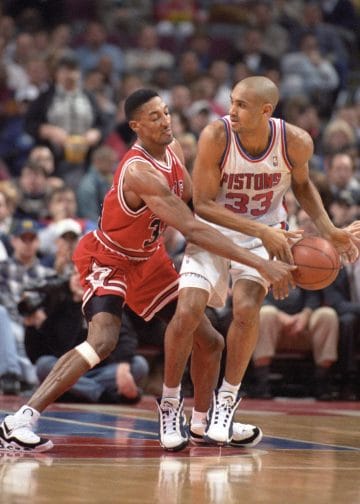 Scottie Pippen strips the ball from Grant Hill — his defensive IQ and quick hands make him a lock for the Top 10 NBA Defenders of All Time.
