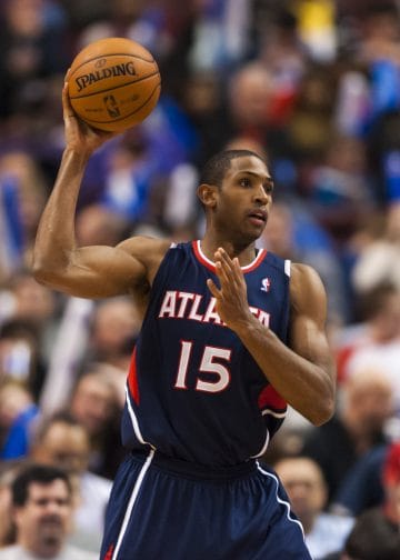 Al Horford preparing to pass during a game, a franchise cornerstone and one of the best Atlanta Hawks players of the 2000s