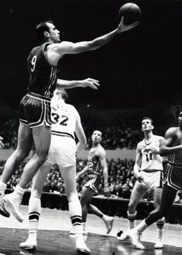 Bob Pettit laying it in during a game, a two-time MVP and foundational figure among the Top 10 Atlanta Hawks of All Time