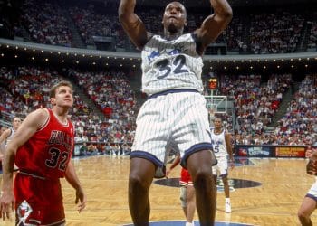Shaquille O’Neal throws down a powerful dunk in an Orlando Magic uniform during his early years, showcasing the dominance that landed him on the Top 10 NBA Centers of All Time list.