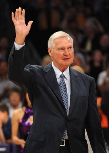 Jerry West waving to Lakers fans, cemented in the Top 10 NBA GMs of All Time for his role in building Showtime and beyond