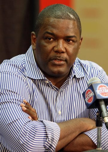 Joe Dumars at a Detroit Pistons press conference, one of the Top 10 NBA GMs of All Time known for building a championship roster