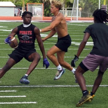  Receiver runs after the catch during 7v7 football with defender in pursuit