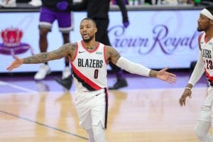 Damian Lillard and Robert Covington celebrate during a game against the Sacramento Kings at Golden 1 Center on January 13, 2021.