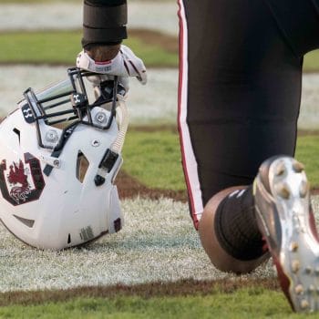 A white Gamecocks helmet rests on the turf ahead of another matchup on the gamecocks football schedule.