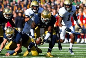Jaylon Smith scoops up a fumble during a Notre Dame game against Georgia Tech.