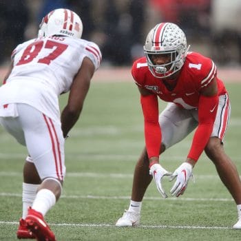 Jeff Okudah prepares for a snap against Wisconsin, featured in the Top 10 Cornerbacks Who Played 7v7 Football of All Time