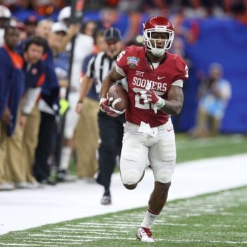  Joe Mixon accelerates for Oklahoma, showing off the all-purpose talent that started in elite 7v7 football circles.