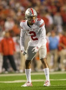 Marshon Lattimore in coverage stance during a night game at Ohio State