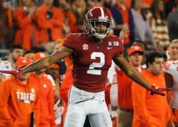Patrick Surtain II extends his arms after a key stop during the national championship game against Clemson