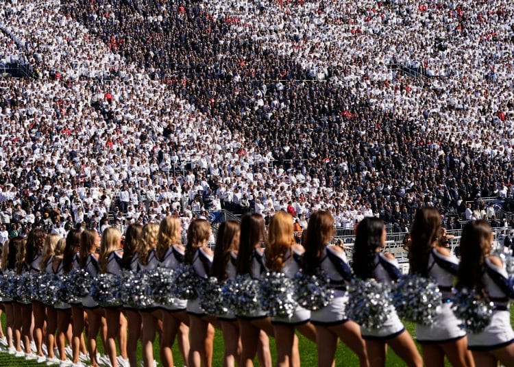 Stripe Out crowd and cheerleaders at the Penn State football stadium during a home game