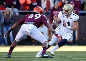Tremaine Edmunds forces a fumble during his college days, featured in the Top 10 Linebackers Who Played 7v7 Football of All Time