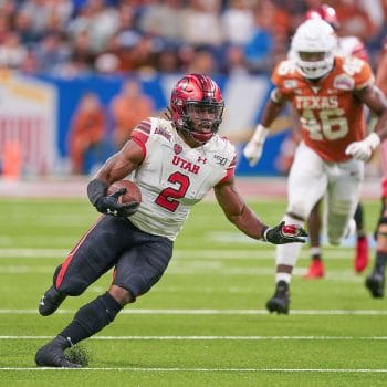 Zack Moss cuts through Texas defenders during his Utah days, flashing the physical style he honed in 7v7 football.
