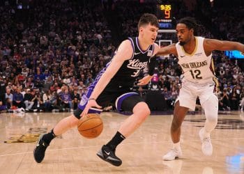 Jake LaRavia drives to the basket for the Kings against the Pelicans during the 2024–25 NBA season.