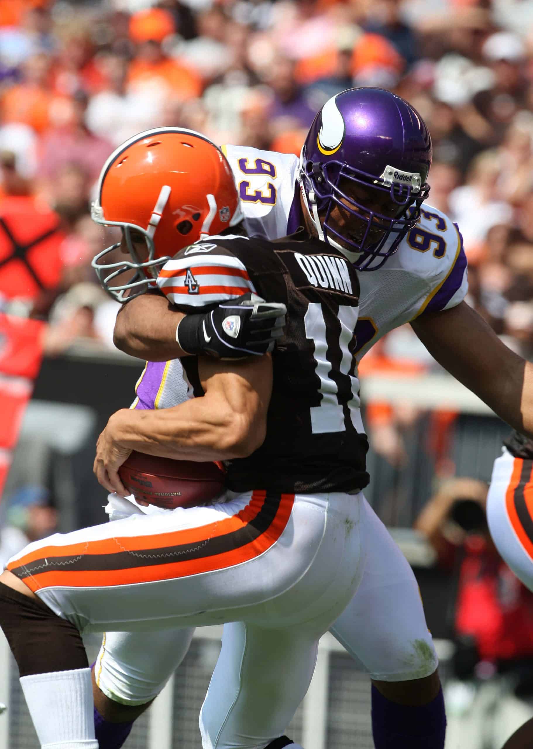 Kevin Williams of the Minnesota Vikings delivering a sack, showcasing dominance as a top pick from the 2003 NFL Draft