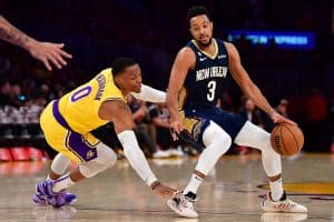 Russell Westbrook defending CJ McCollum during a Lakers vs. Pelicans game, representing a failed roster fit from the 2021 trade.