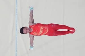Xiao Ruoteng holding a handstand on horizontal bar at the Male Artistic Gymnastics Olympics in Paris 2024