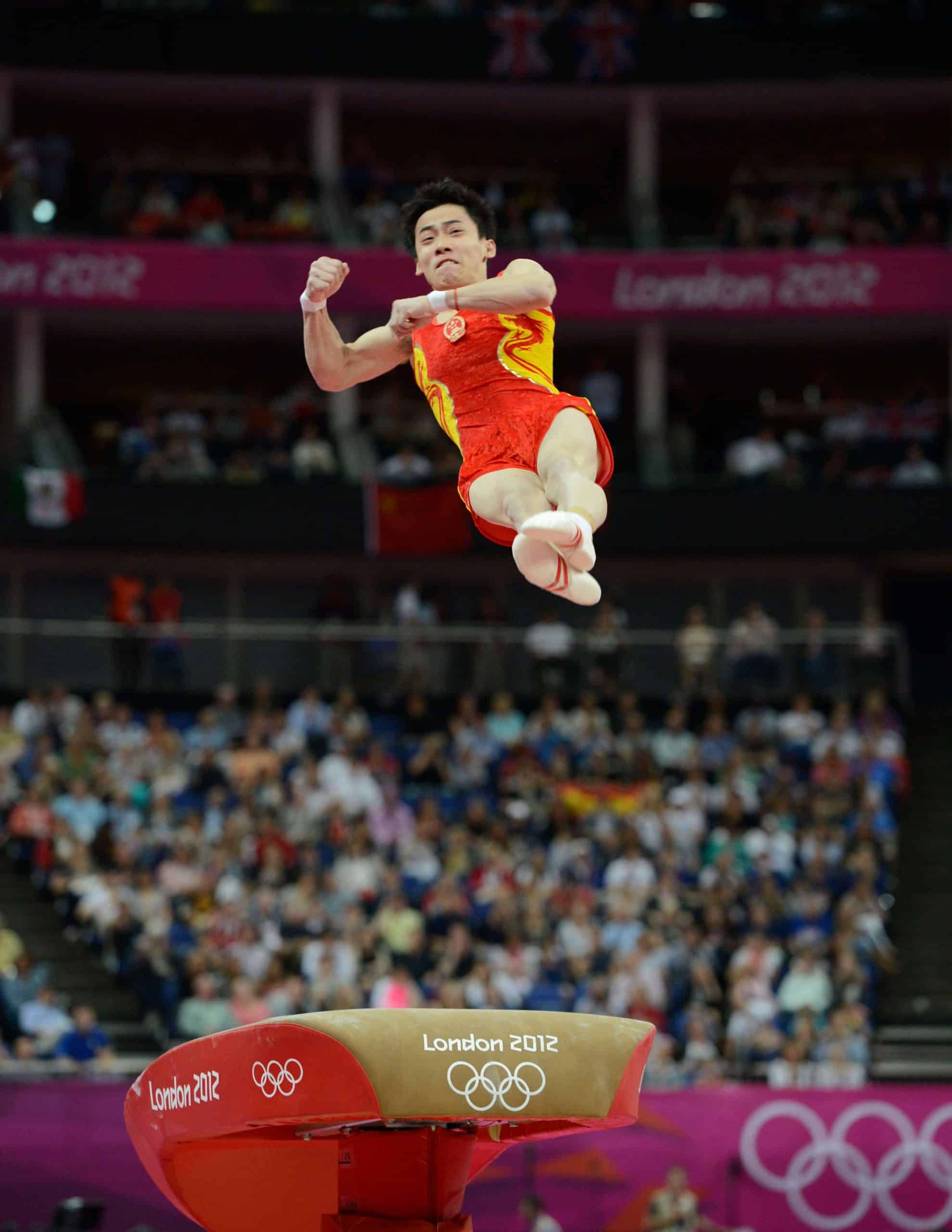 Zou Kai competes on vault at the London 2012 Games, representing the Male Artistic Gymnastics Olympics Champions for China